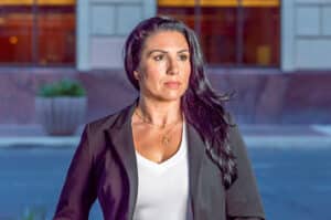 A dark haired woman's headshot in downtown Tucson.