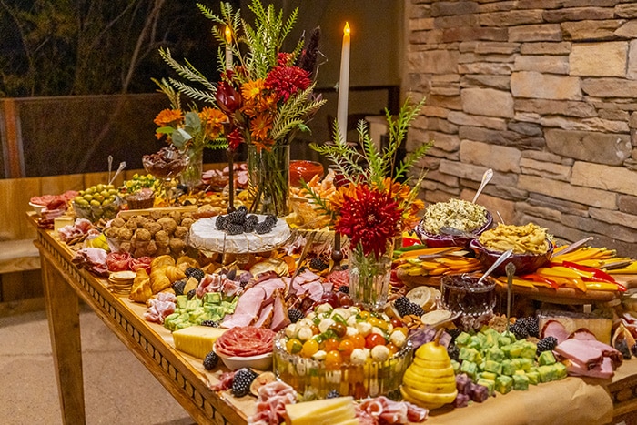 Signature Group’s Red Carpet Event photo with a grand food table display